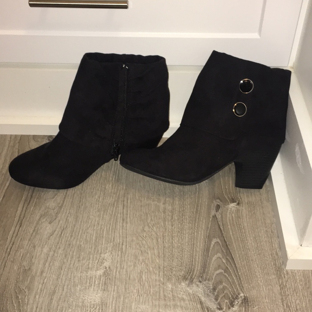 Black suede booties with chic buckle detail